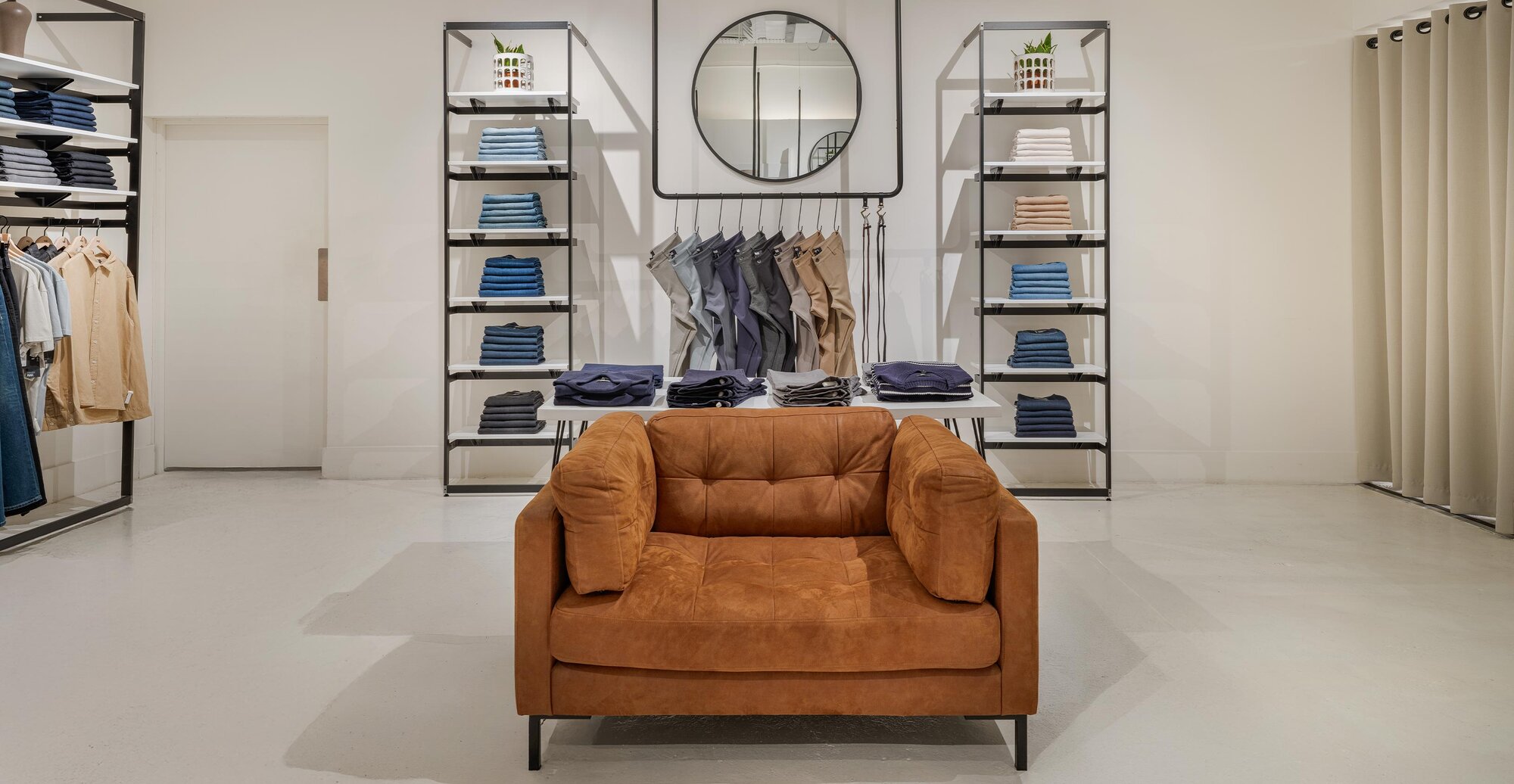 Interior shot of PAIGE retail store featuring PAIGE denim in all colors