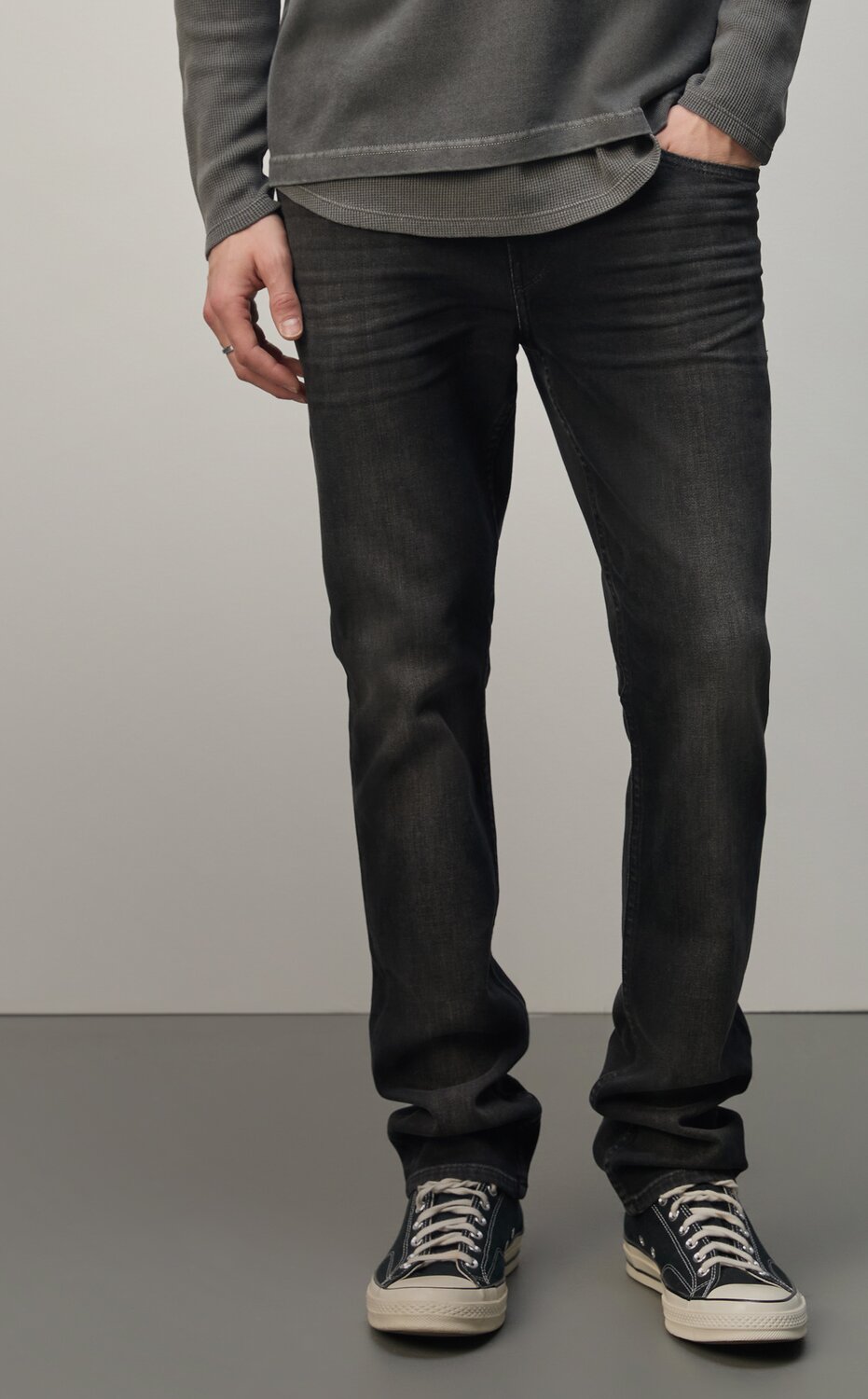 A collection of PAIGE denim jeans in an array of washes from light to dark