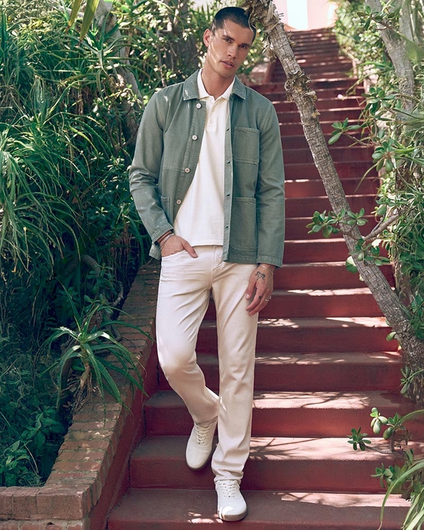 Man wearing a light brown textured short sleeve button up shirt