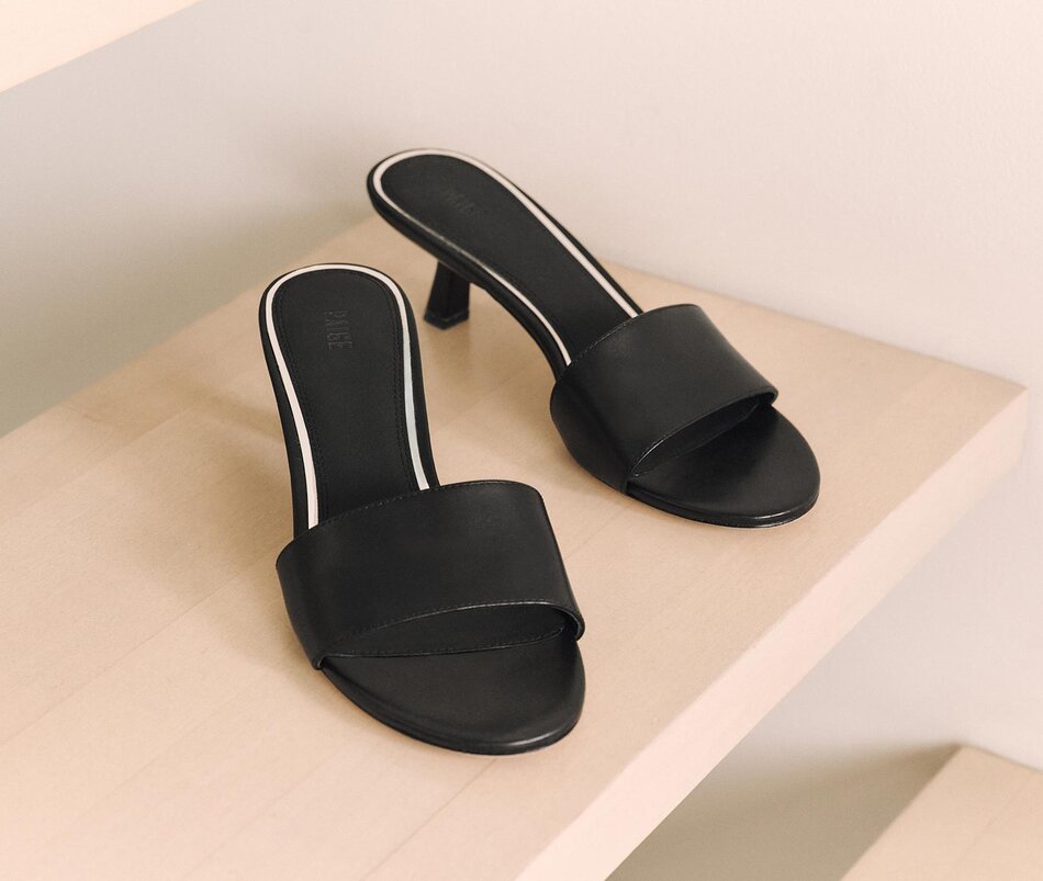 A pair of black heel mule sandals