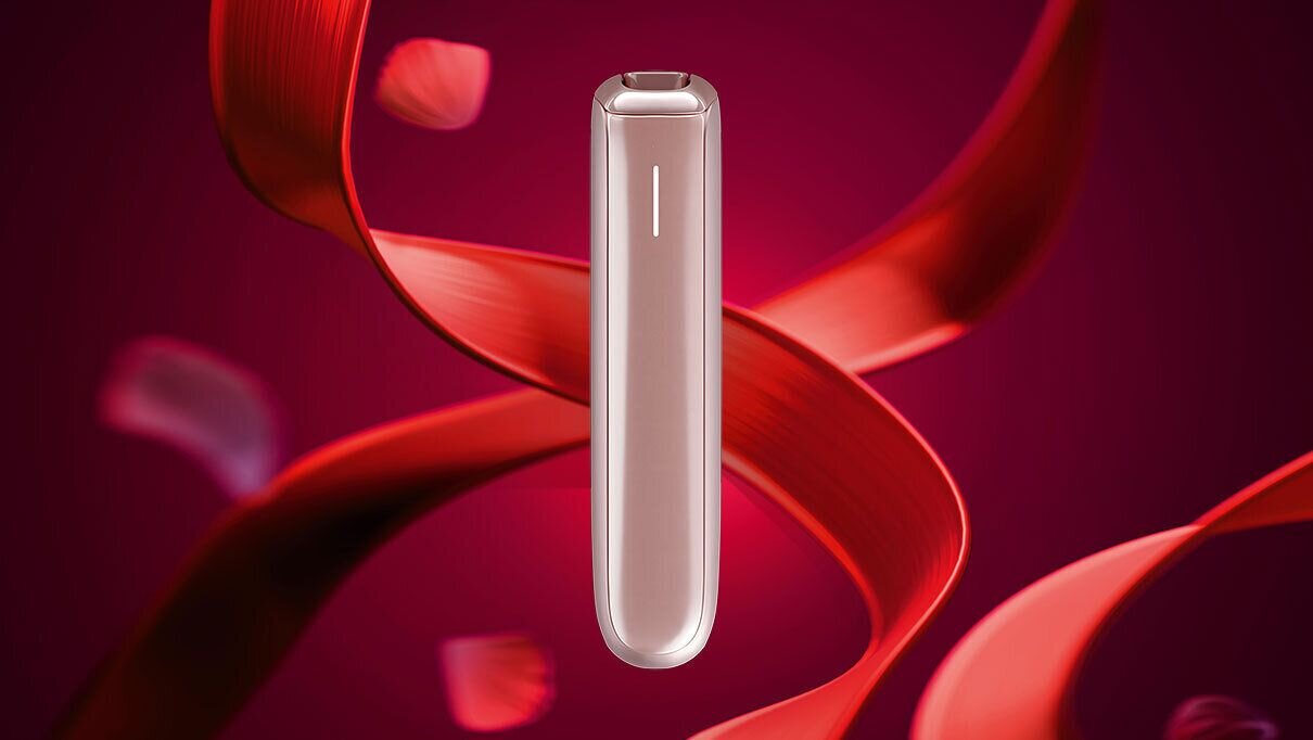 Ploom AURA Rose Gold device on a deep red elegant background.