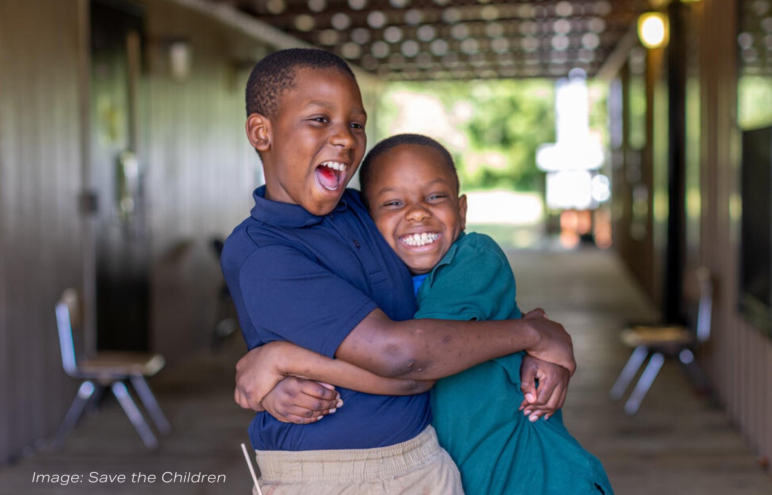Two boys hugging