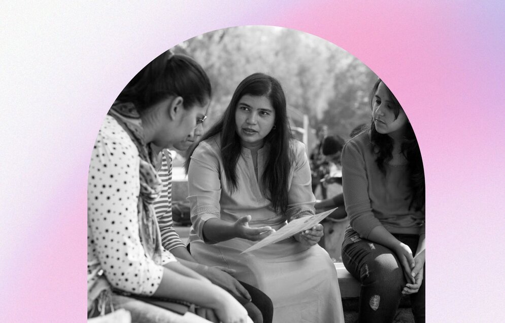 A young woman holding up a poster about equal rights
