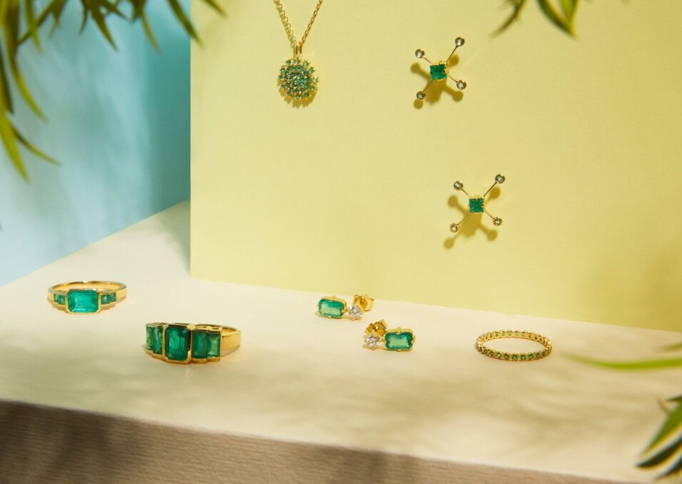 1 woman in a denim outfit and another woman in a white dress with black boots