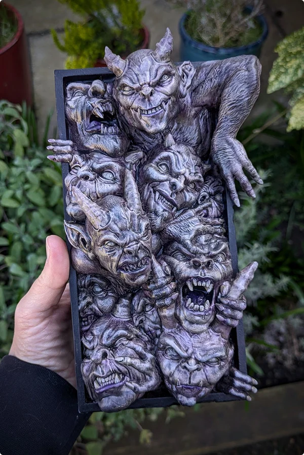 Hand-painted book nook with faces of demons