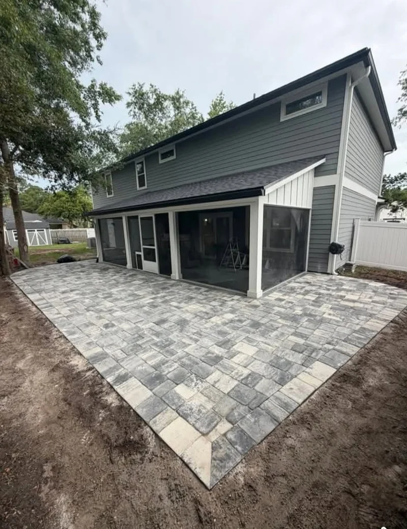 Screened patio with a newly installed paver surface