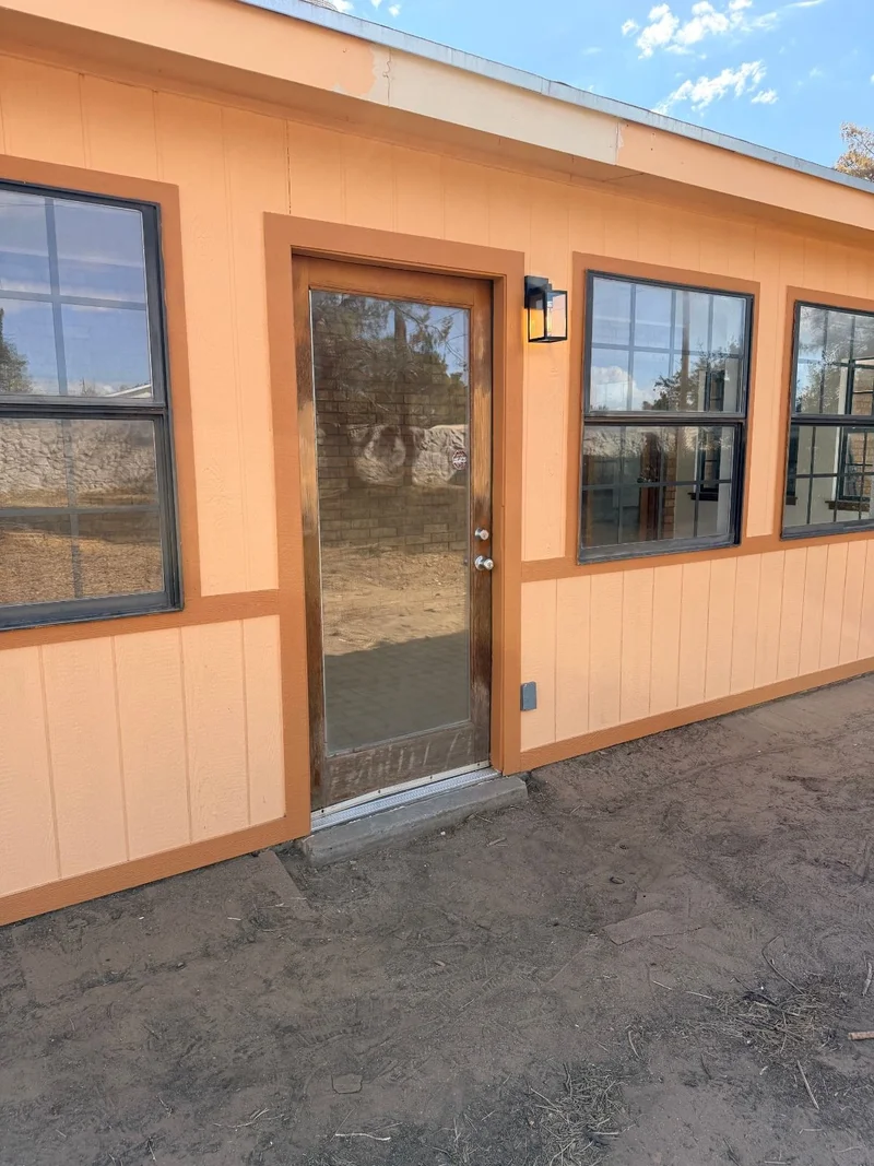 Completed exterior door and siding repair