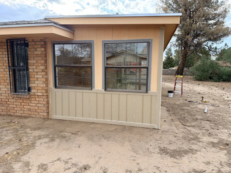 Finished exterior repair beside brickwork