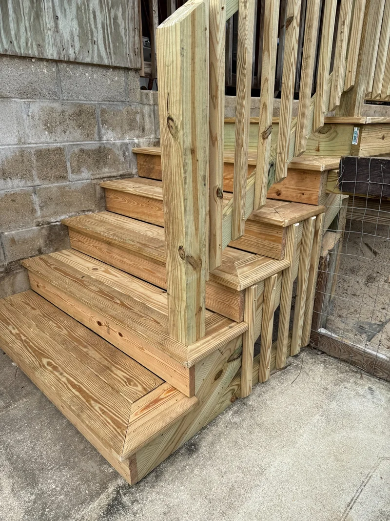 New pressure-treated wood stairs and railing