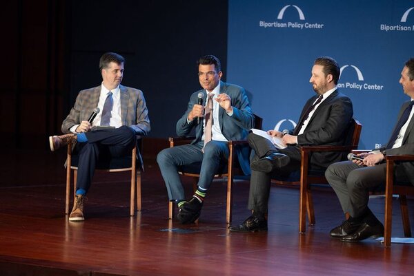 Photo: Sonnesyn moderates a panel discussion between Jason Grumet, CEO of the American Clean Power Association; Marsden Hanna, Global Head of Sustainability and Climate Policy at Google; and Sasha Mackler, Senior Vice President and Global Head of Strategic Policy at ExxonMobil.