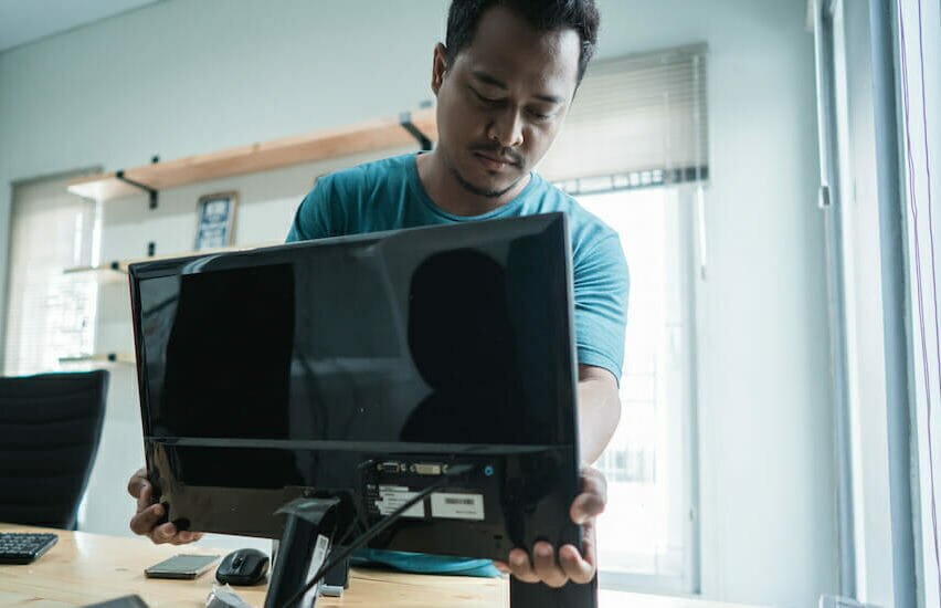 Man setting up his office at home