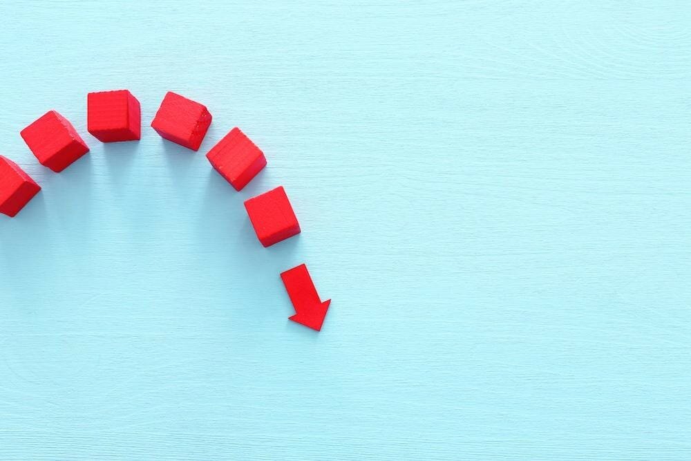 red bricks forming an arrow on a blue background
