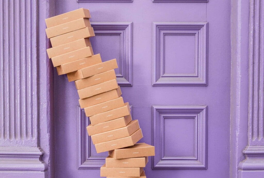 Photo of a tower of boxes collapsing