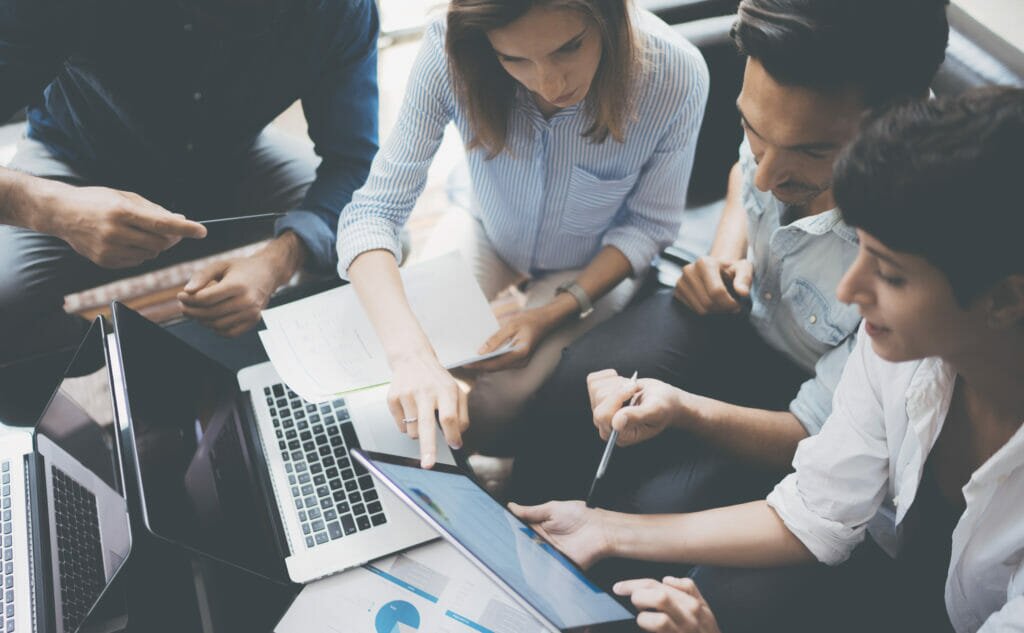 Team of product mangers discussing data 