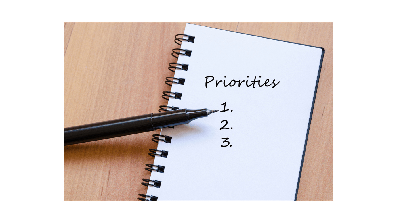 A pen on a spiral notebook Description automatically generated