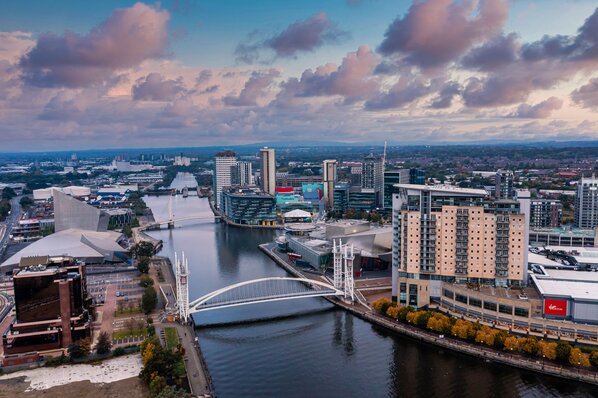 Aerial view of the Media City UK is on the banks of the Manchester at dusk