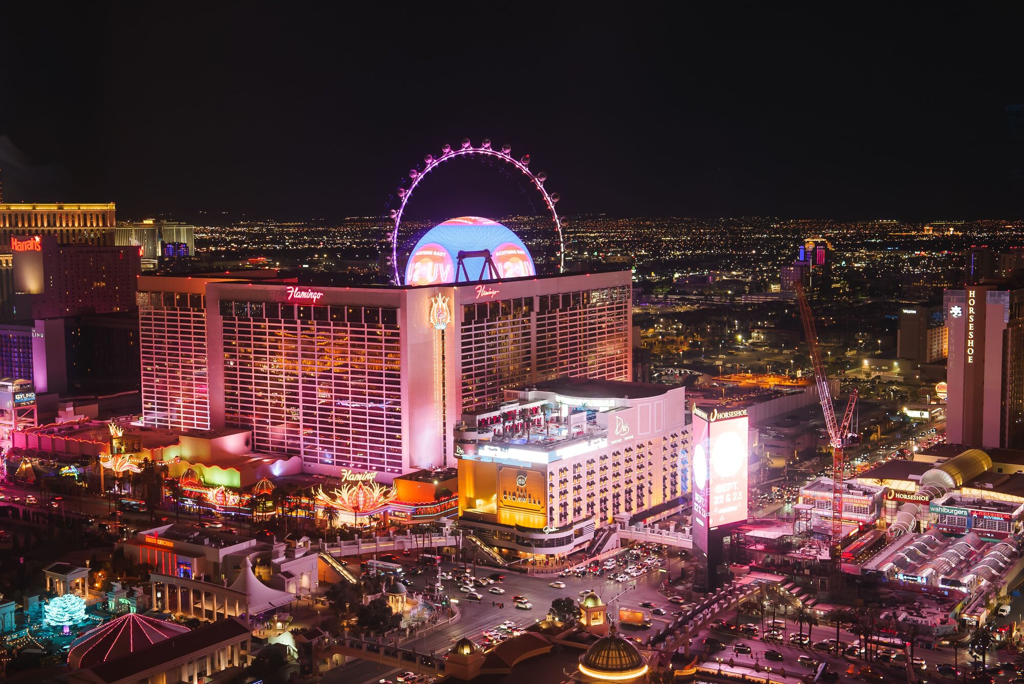 Vibrant aerial view of las vegas strip at night illuminated by bright lights