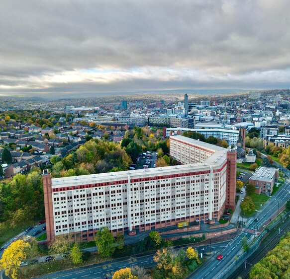 High angle view of buildings in city against sky