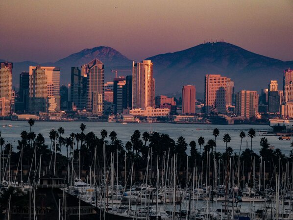 Panoramic view of modern buildings in city at dusk