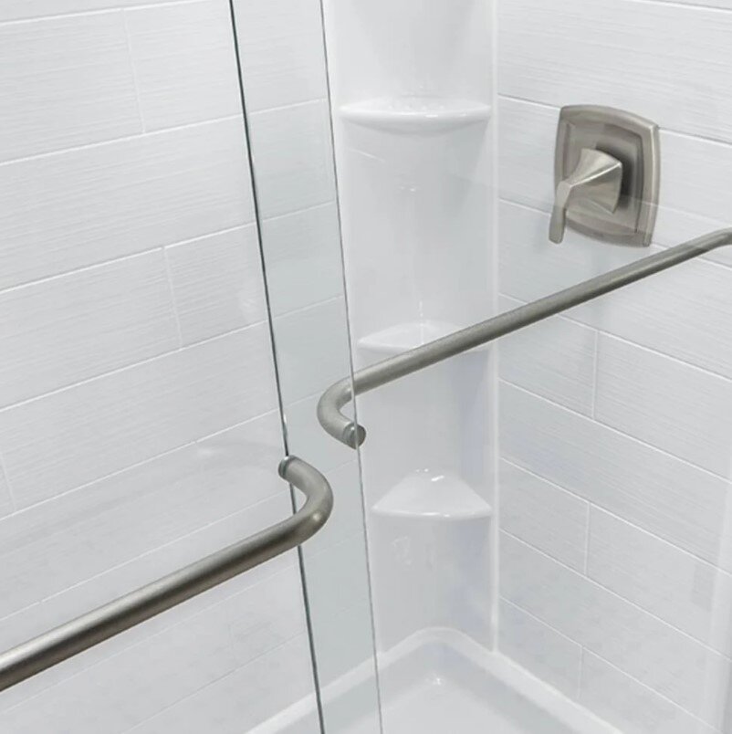 bathtub with black rectangular door