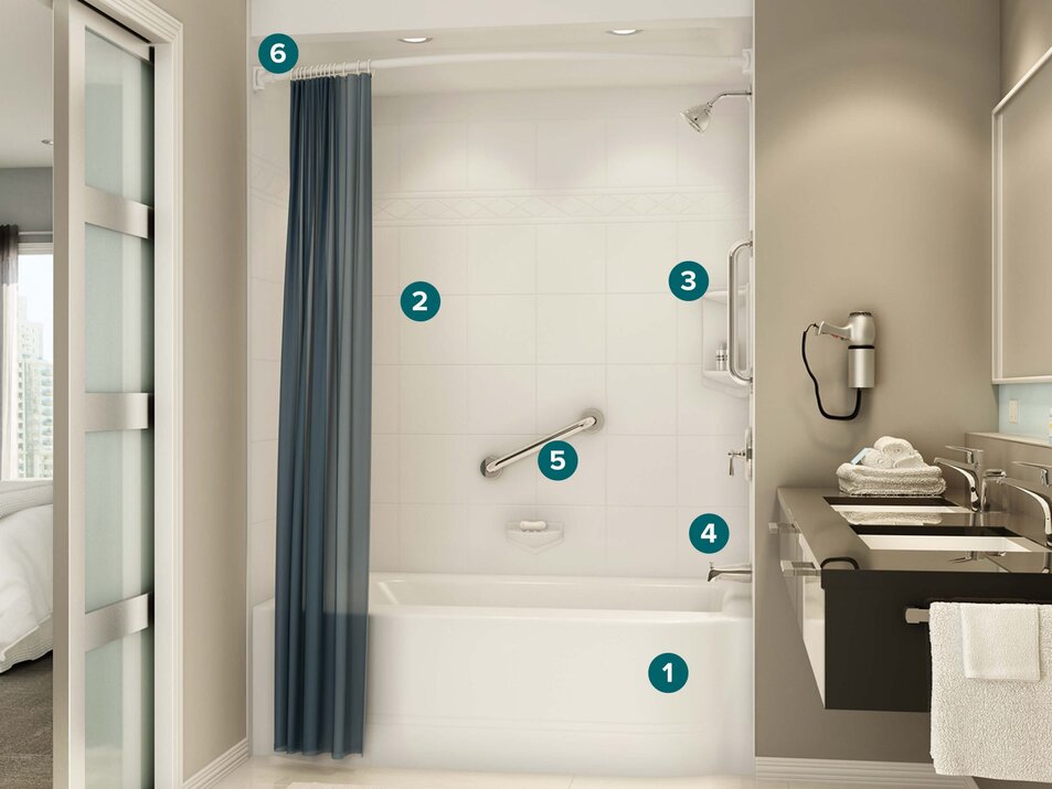 Older couple reviewing bathroom remodel options with Bath Fitter expert