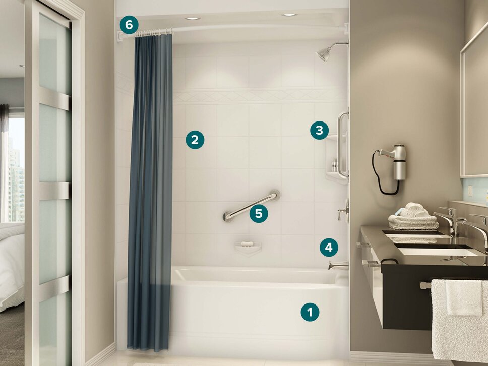 Older couple reviewing bathroom remodel options with Bath Fitter expert