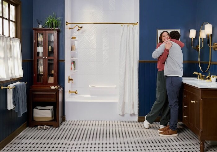 Bathroom remodel including bathtub, gold shower head and finishes, shelves 