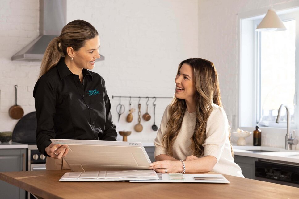 Bath Fitter bathroom expert helping customer with design options 