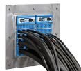 Several CAT8 cables plugged into a set of ethernet ports.
