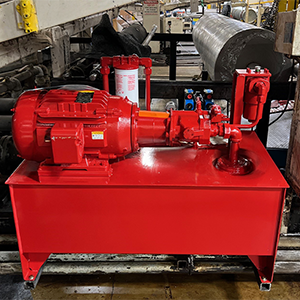 A custom hydraulic power unit designed and painted red by Motion Repair & Services.