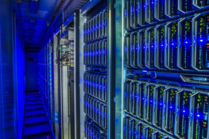 A row of servers illuminated by blue lights.