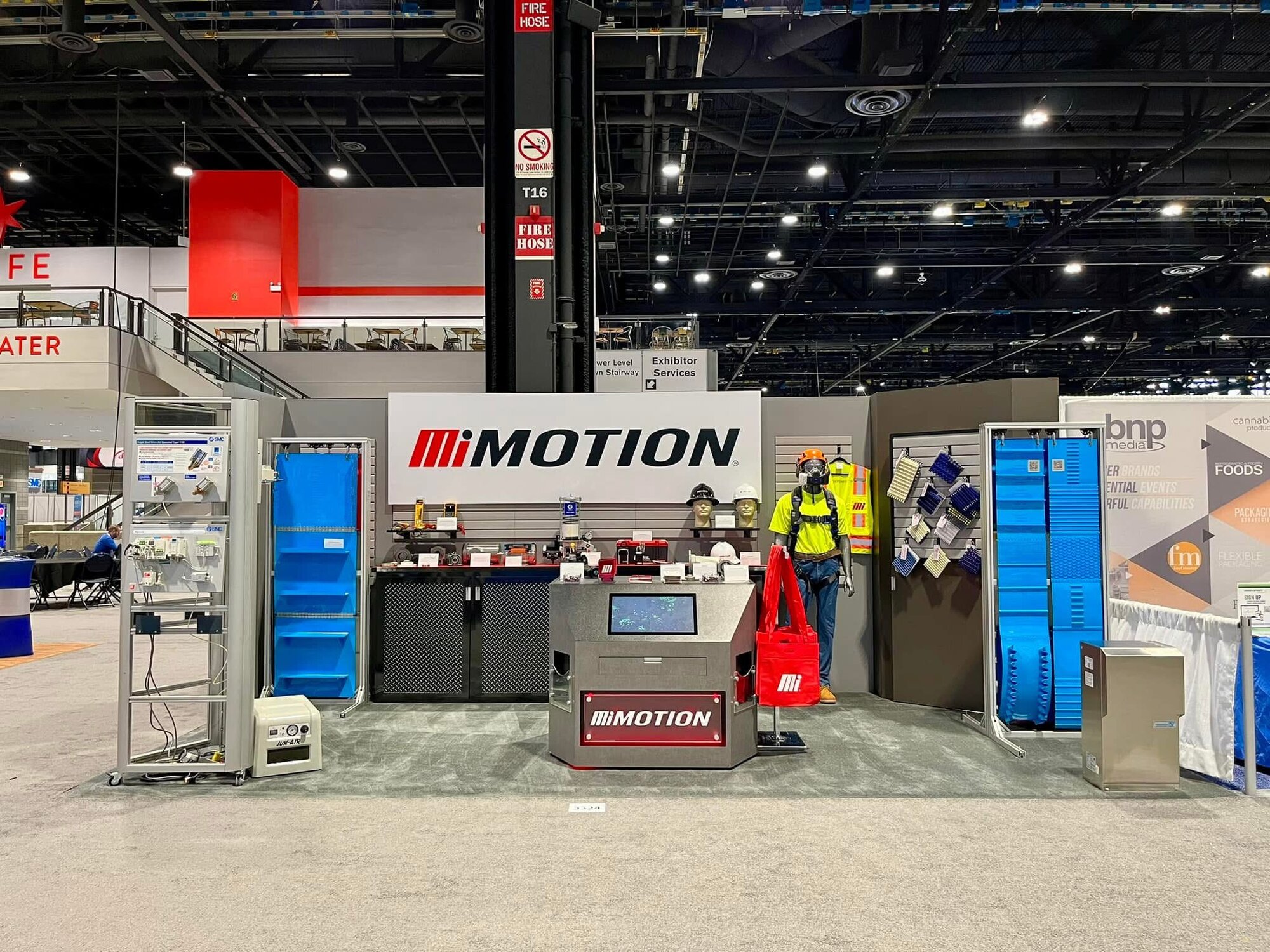 Motion at booth #A5106 at MODEX, interacting with patrons.