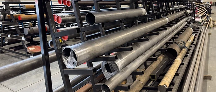 Several custom built and repaired cylinders sit on a shelf.