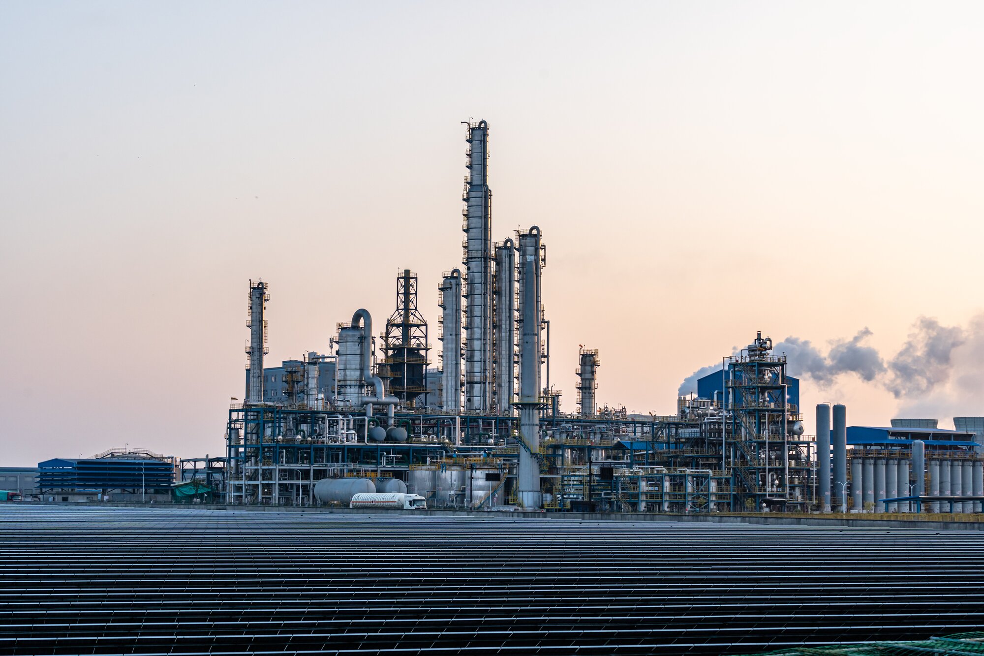 An industrial plant during sunrise