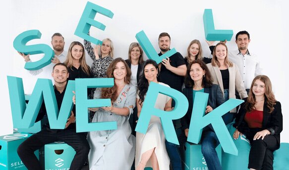 Eine Gruppenfoto von SELLWERK Mitarbeitern