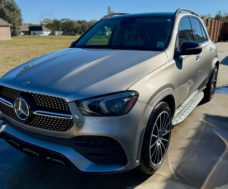 Silver Mercedes-AMG SUV with gleaming finish and professional detailing showcase