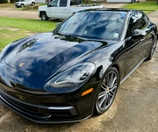 Black Porsche sports car with glossy showroom-quality finish