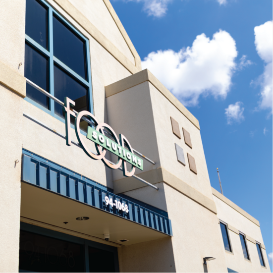 The Food Solutions International building under a blue sky