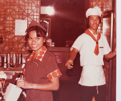 Two Zippy's employees in 1980s uniforms at a restaurant
