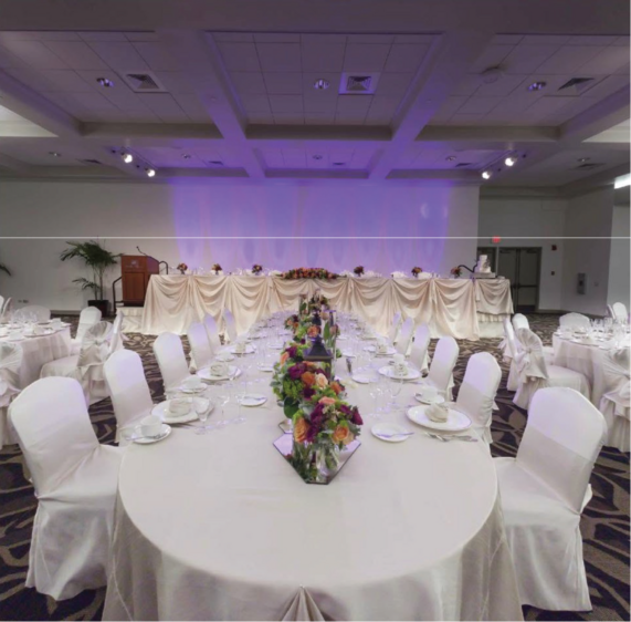 A banquet table set for a wedding reception in the Pōmaika‘i Ballrooms