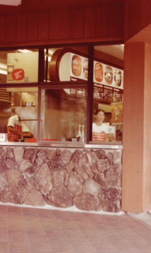 Customers lined up at a Zippy's takeout counter in the 1970s