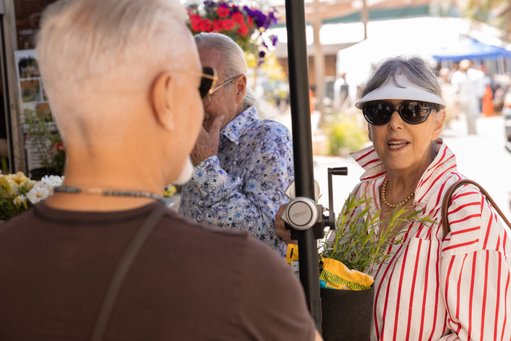 A woman purchases gardening products at Anawalt's 100th Anniversary celebration in Hollywood