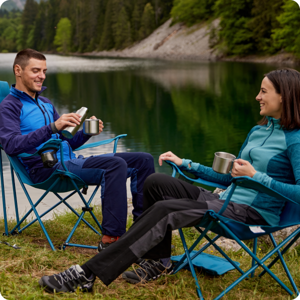 people sitting by lake