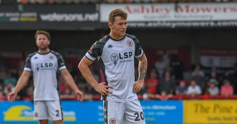 player wearing bromley fc 2023-24 home shirt in white and black