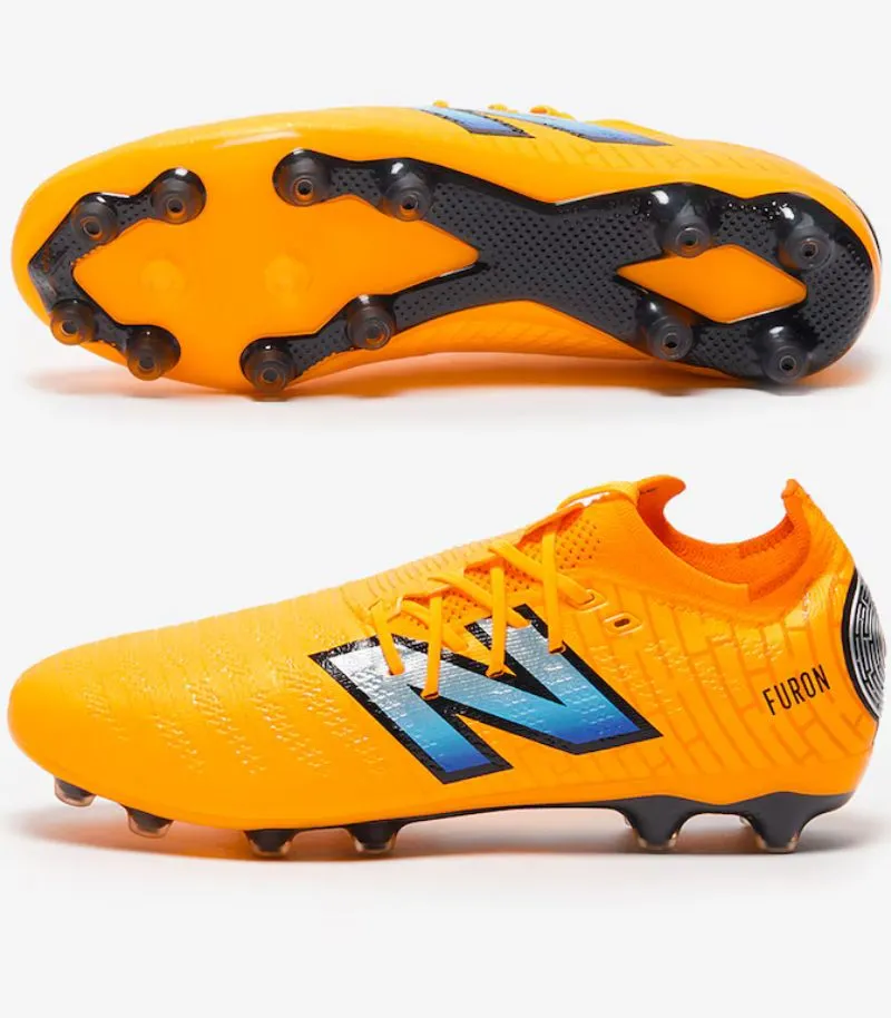 new balance furon V7+ boots in orange with artificial grass sole plate 