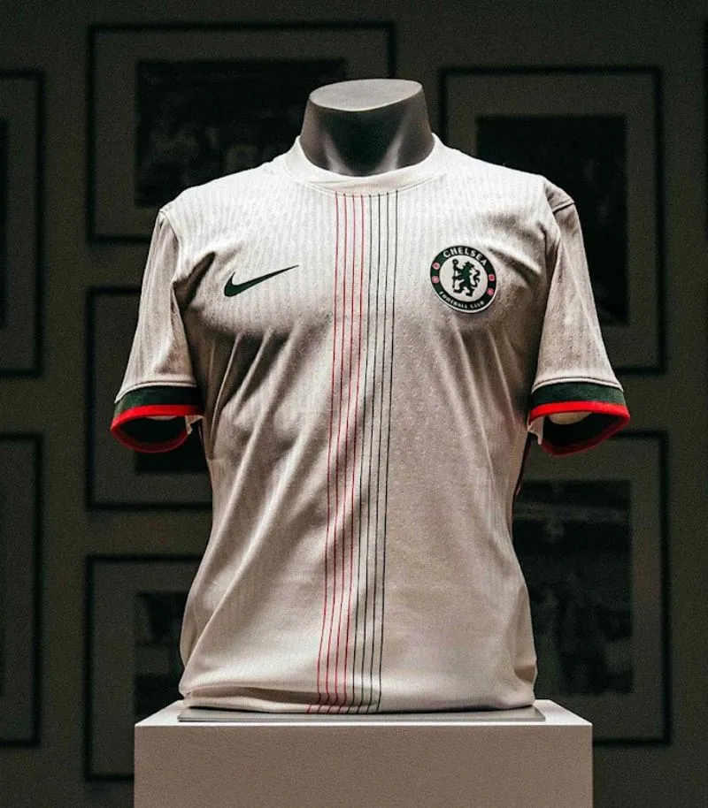 white chelsea away shirt with orange and green stripes