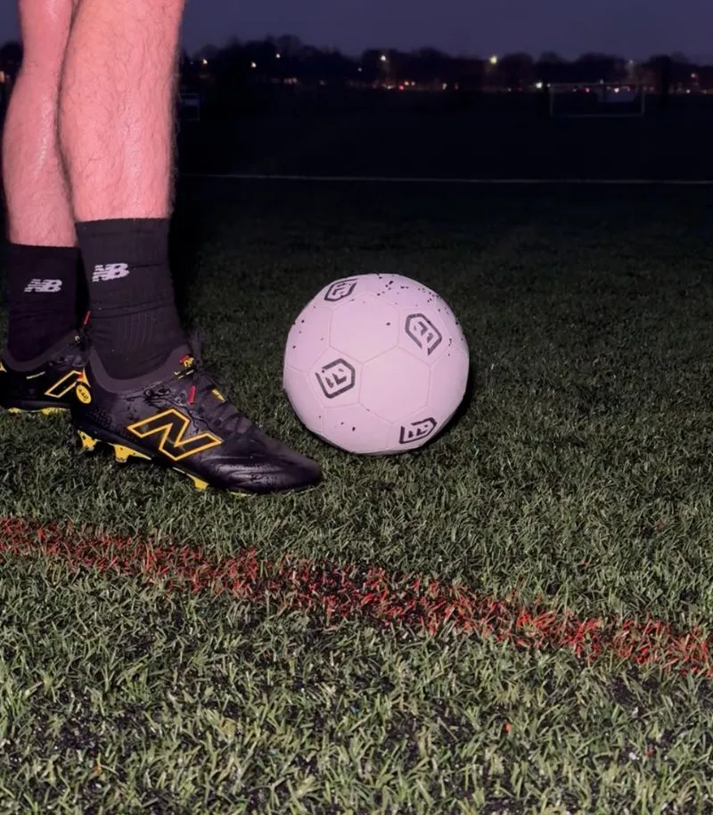 new balance 442 football boots in black and yellow