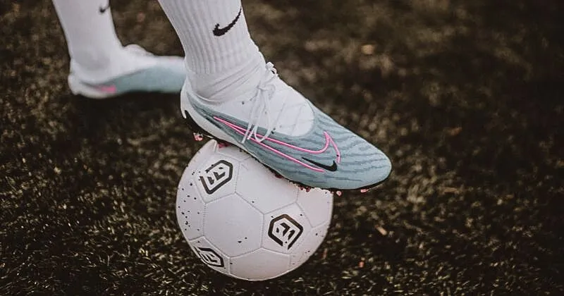 nike football boots on top of a white football with FOOTY.COM branding 