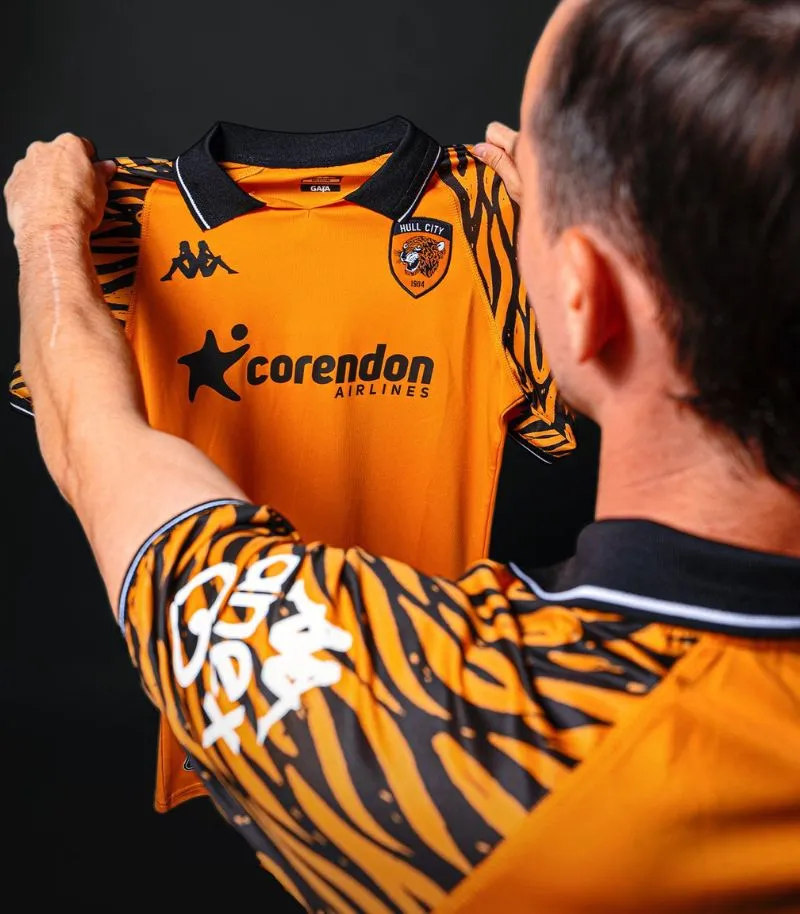 new hull home kit in orange with tiger print sleeves