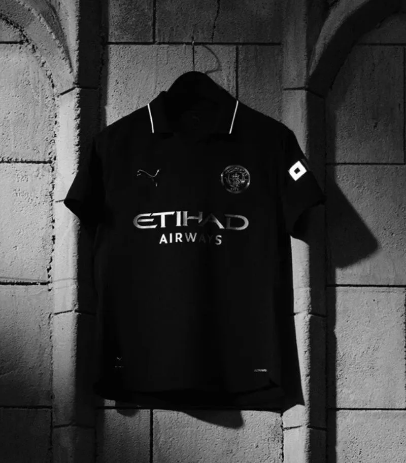 black man city away shirt